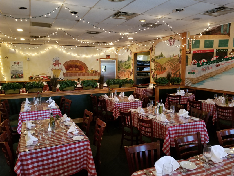 Angeli's Main Dining Room with checkered tablecloths and string lights